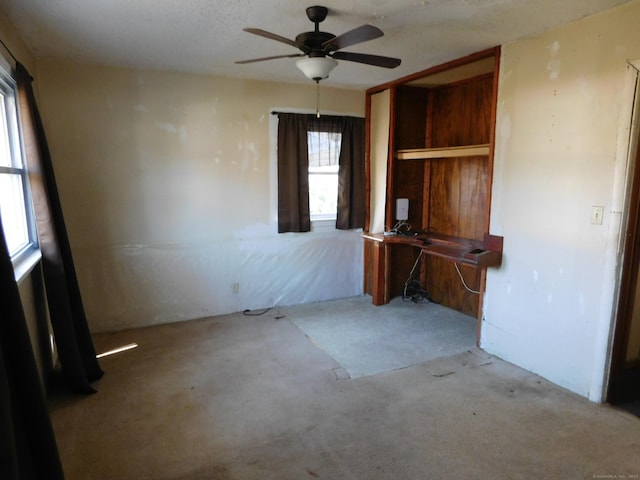 interior space featuring a ceiling fan