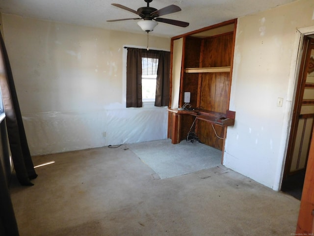 unfurnished office featuring a ceiling fan