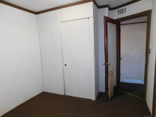 interior space with visible vents and a closet