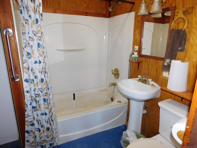 full bath with tile patterned floors, toilet, and shower / bath combo