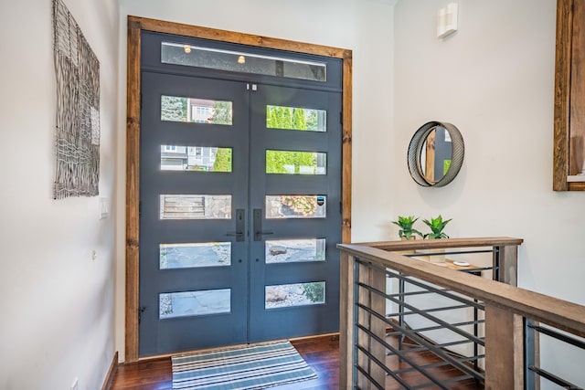 foyer entrance with dark wood finished floors and french doors