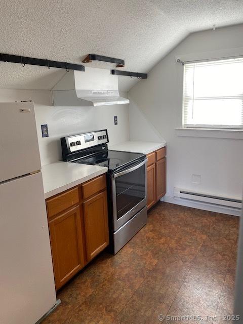 kitchen featuring brown cabinetry, electric range, a baseboard heating unit, and freestanding refrigerator