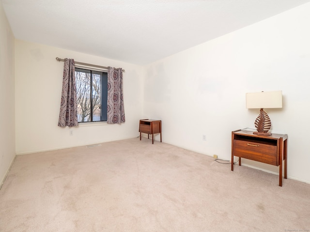 spare room featuring carpet flooring