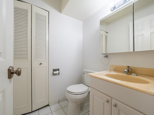 bathroom featuring tile patterned floors, toilet, and vanity