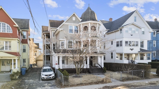 view of front facade featuring a fenced front yard and covered porch