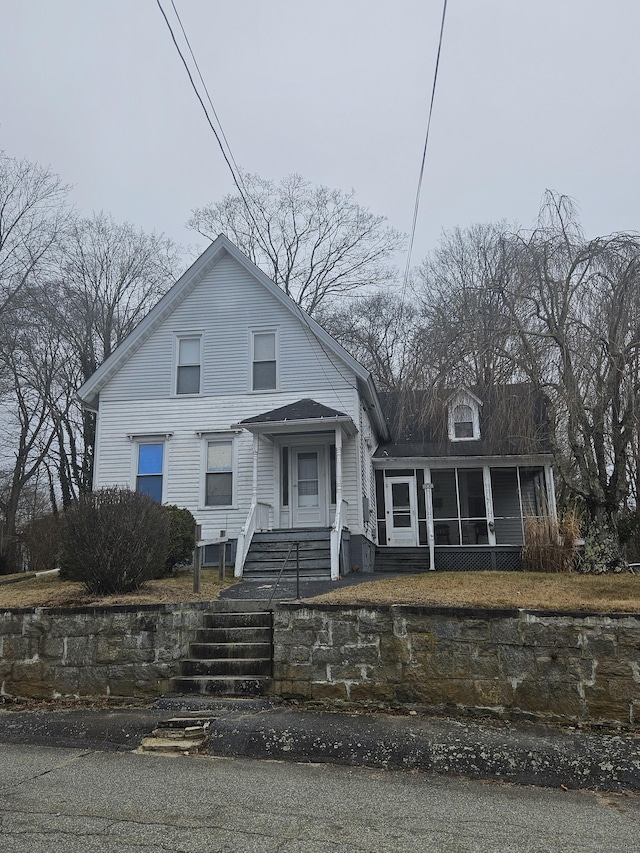 view of front of property with a sunroom