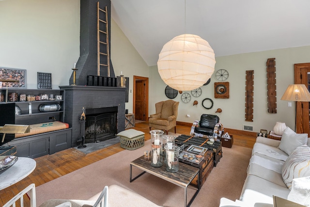 12 Old Forge Hollow Rd, Litchfield, CT 06750 - living room with wood finished floors, a fireplace, and vaulted ceiling