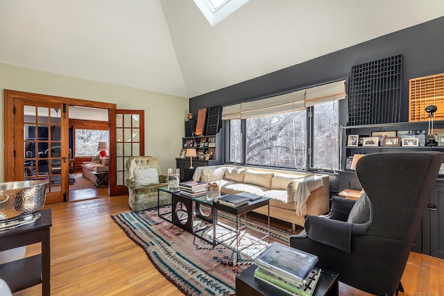 12 Old Forge Hollow Rd, Litchfield, CT 06750 - living area with plenty of natural light, french doors, wood finished floors, high vaulted ceiling, and a skylight