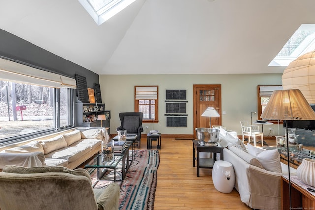 12 Old Forge Hollow Rd, Litchfield, CT 06750 - living room featuring a skylight, lofted ceiling, and light wood finished floors