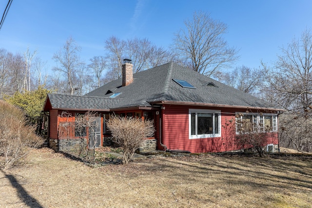 12 Old Forge Hollow Rd, Litchfield, CT 06750 - back of property featuring a chimney, a shingled roof, and a lawn