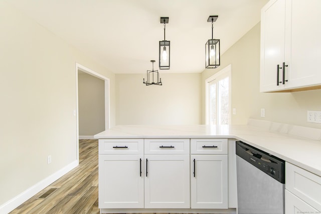 kitchen with stainless steel dishwasher, light wood-style floors, baseboards, a peninsula, and white cabinetry