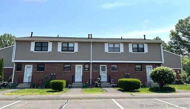 305 Hampton Ct Unit 305, Newington, CT 06111 - multi unit property featuring entry steps, brick siding, and uncovered parking
