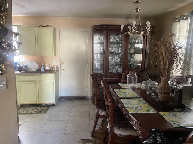 dining room featuring a notable chandelier and light tile patterned floors