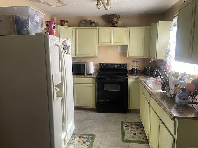 kitchen with green cabinetry, white fridge with ice dispenser, and black range with electric cooktop