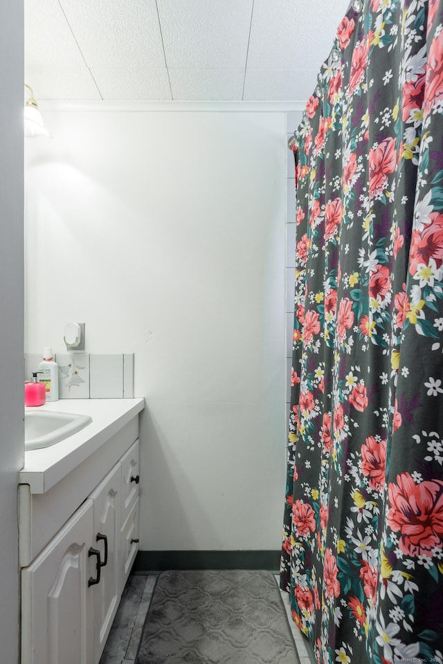 bathroom with vanity and curtained shower