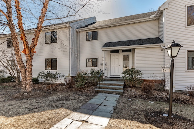 view of front of house with roof with shingles