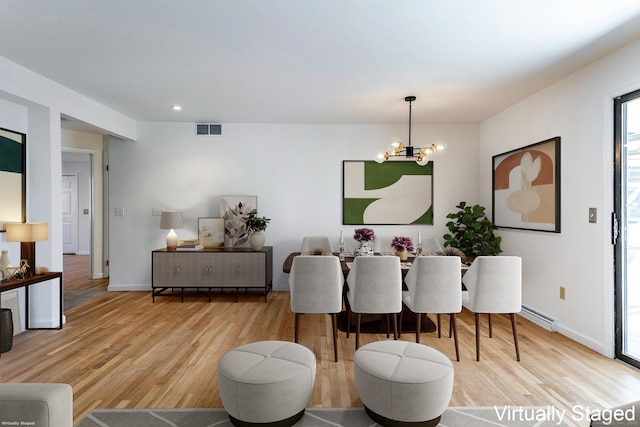 dining space with a chandelier, visible vents, light wood-style flooring, and baseboards