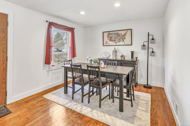 dining area with visible vents, recessed lighting, wood finished floors, and baseboards