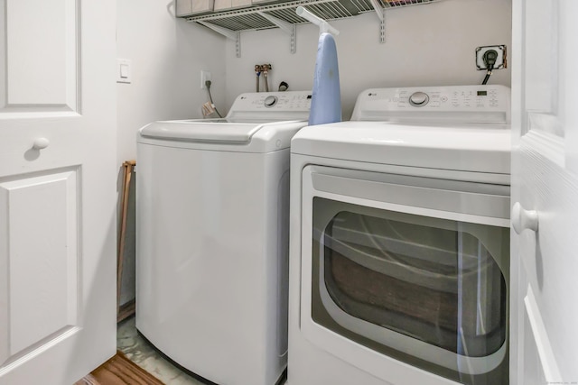 laundry room featuring washer and clothes dryer and laundry area