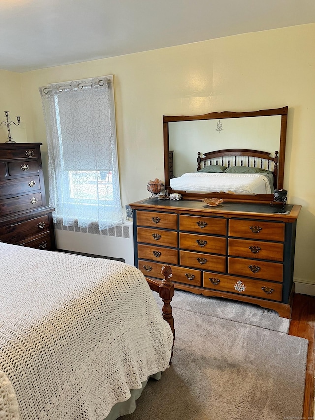 bedroom featuring radiator heating unit