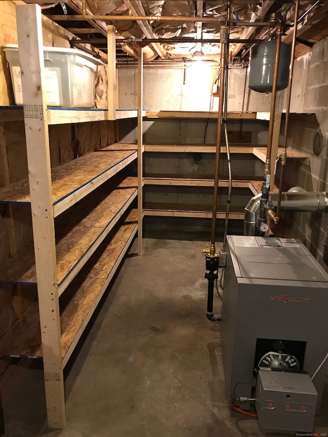 unfinished basement featuring a heating unit