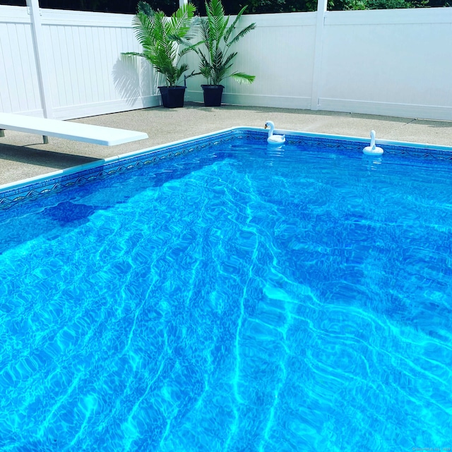 view of pool featuring a fenced in pool and fence