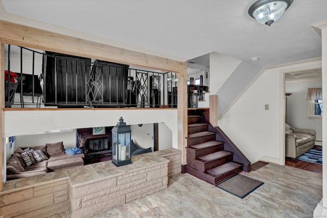 living area featuring stairway and baseboard heating