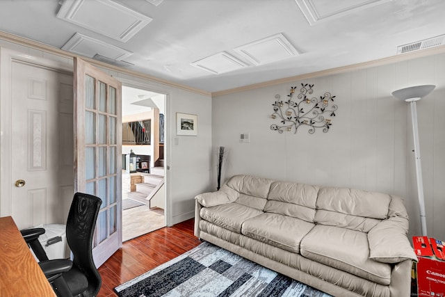 office area featuring visible vents, attic access, wood finished floors, and crown molding