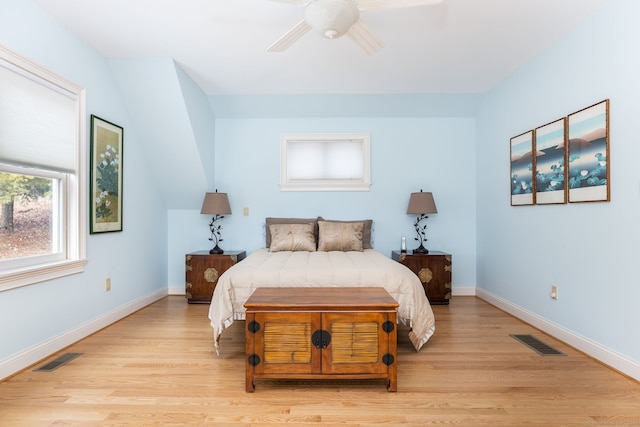 bedroom with light wood-style flooring, baseboards, and visible vents