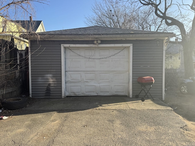 detached garage with concrete driveway