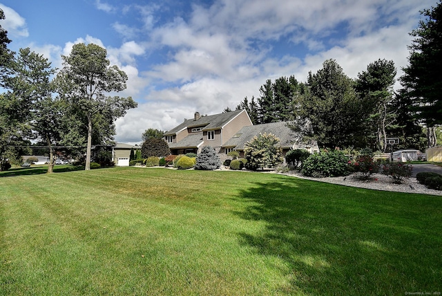 view of yard with a garage