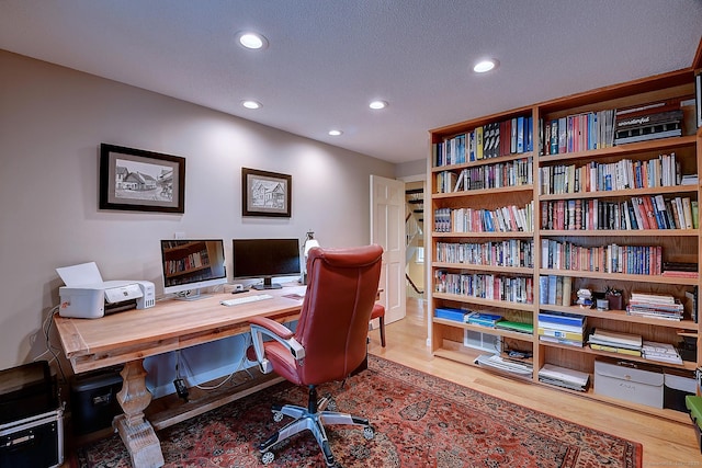 home office with recessed lighting and wood finished floors