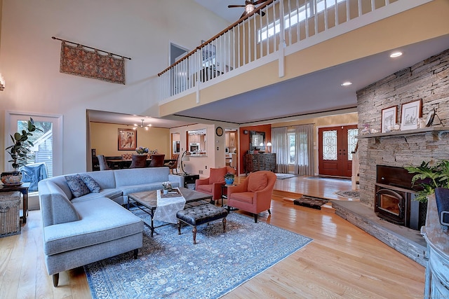 living area with ceiling fan and wood finished floors