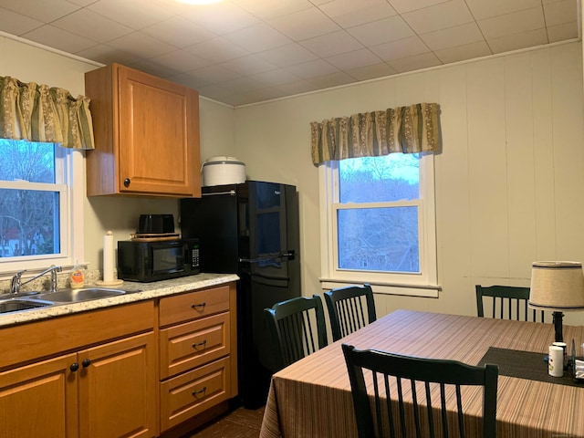 28 Bowhay Hill Rd, Branford, CT 06405 - kitchen with crown molding, black appliances, light countertops, a sink, and brown cabinets