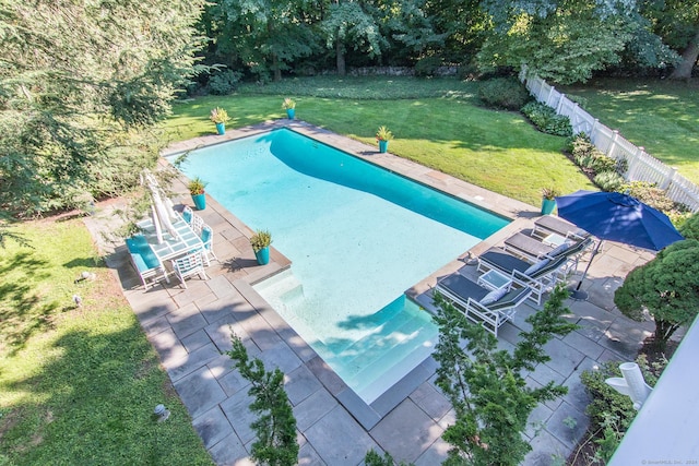 view of pool featuring a yard, a fenced in pool, a fenced backyard, and a patio area