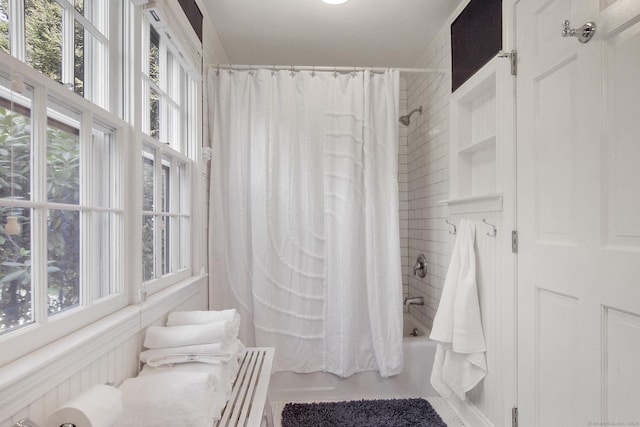 bathroom featuring shower / tub combo with curtain