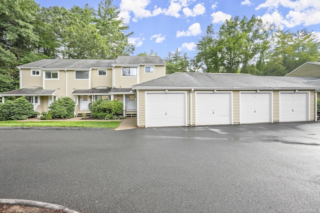 townhome / multi-family property featuring community garages