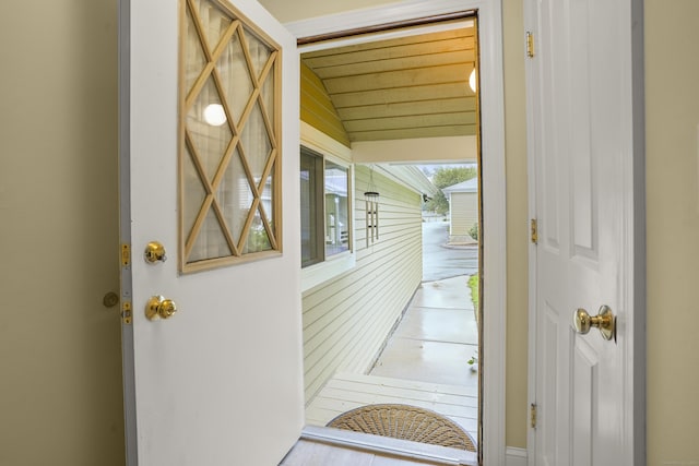 hallway with vaulted ceiling