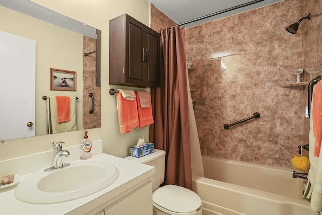 full bath with toilet, shower / bath combo, vanity, and a textured ceiling