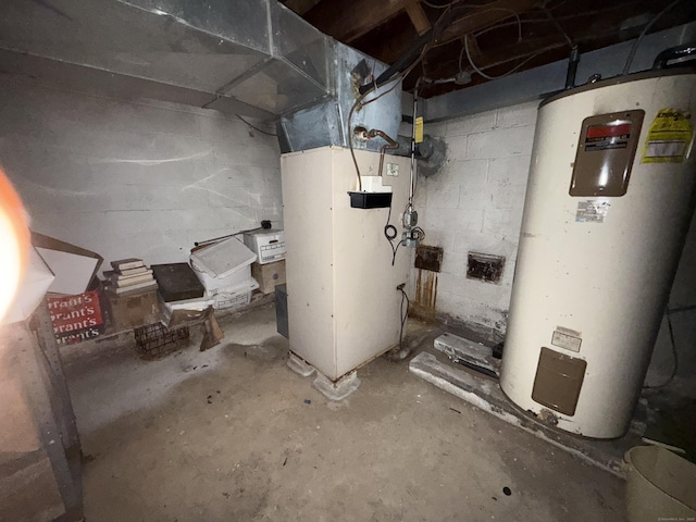 utility room featuring water heater and heating unit