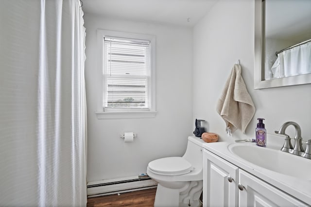 full bathroom with a baseboard radiator, toilet, wood finished floors, and vanity