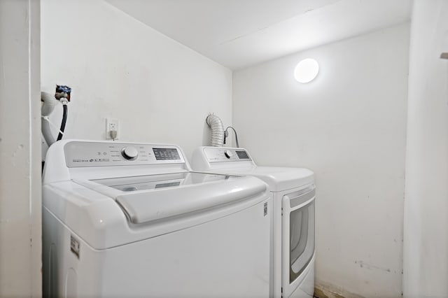 laundry room with laundry area and separate washer and dryer