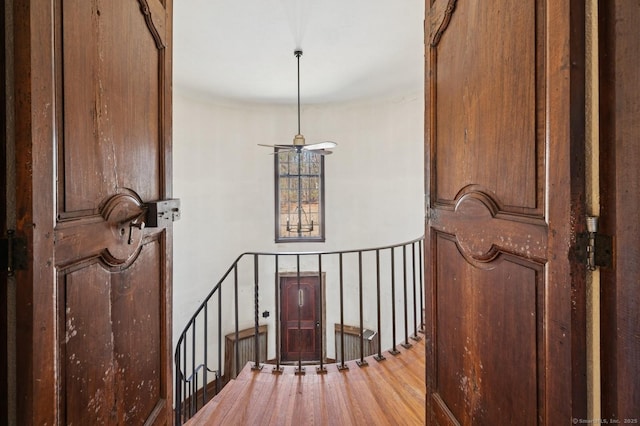 stairway with wood finished floors