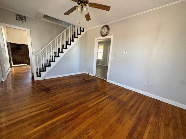 empty room with stairs, hardwood / wood-style flooring, baseboards, and ceiling fan