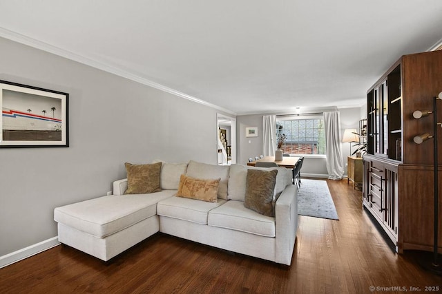 living room with crown molding, baseboards, and dark wood-style flooring