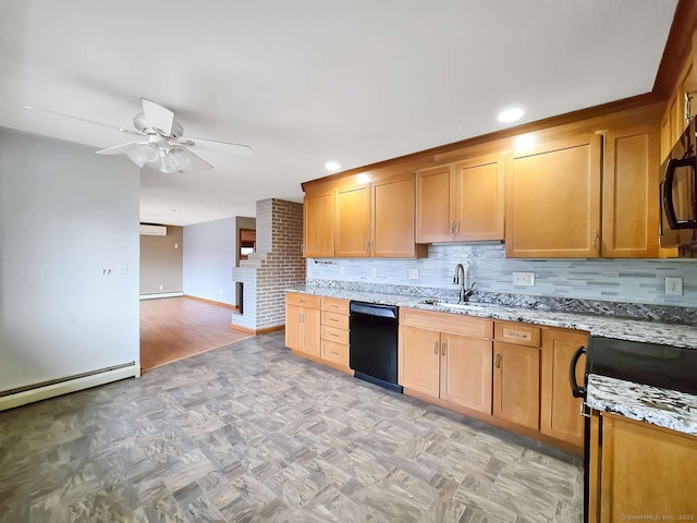 kitchen featuring black appliances, a sink, light stone counters, tasteful backsplash, and ceiling fan