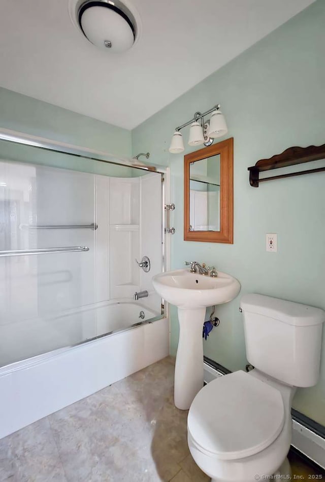 bathroom with toilet, combined bath / shower with glass door, and a baseboard radiator