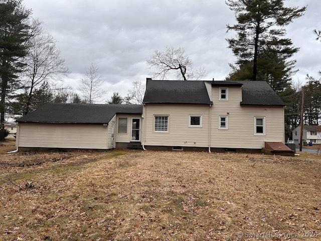 rear view of house featuring entry steps