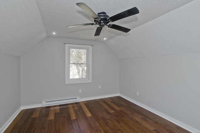 bonus room featuring wood finished floors, baseboard heating, and a textured ceiling