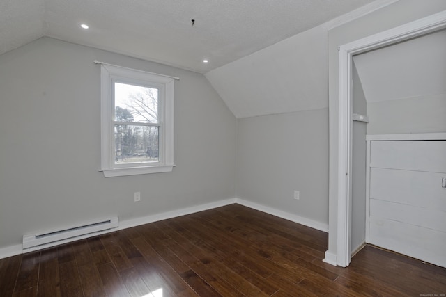 additional living space featuring wood finished floors, baseboards, recessed lighting, vaulted ceiling, and baseboard heating